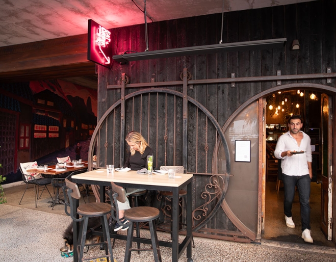 Waiter in door of Monsieur Chow
