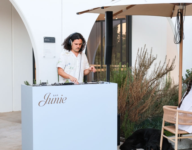 DJ spinning vinyls at Bar Junie 