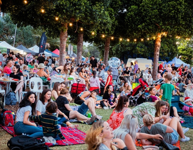 Crowd and lights at HOTA Twilight Christmas Market 
