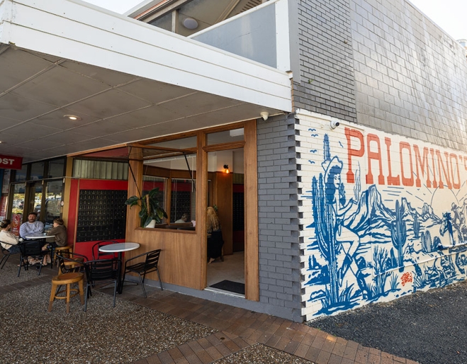 Side view with mural of Palomino's Deli