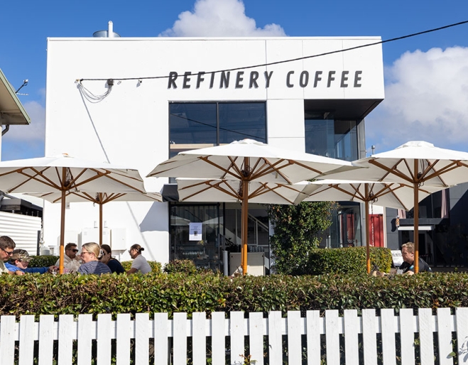 Outside view of Refinery Coffee behind fence