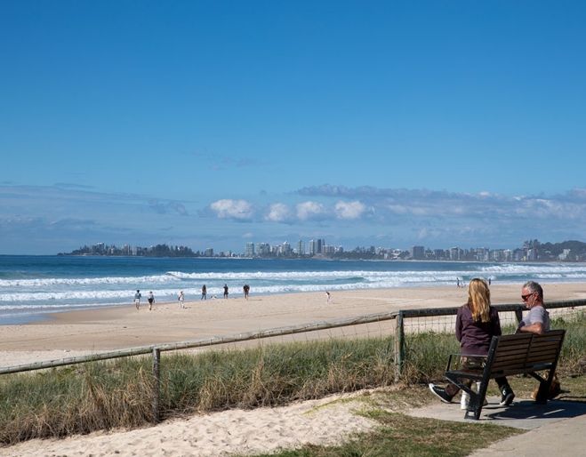 People on seat overlooking Tugun Beach