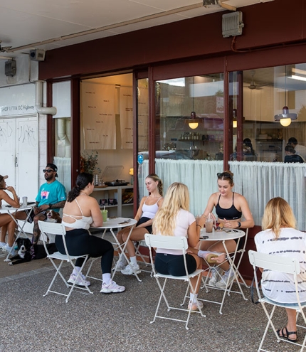 People sitting outside 94 Morning Club