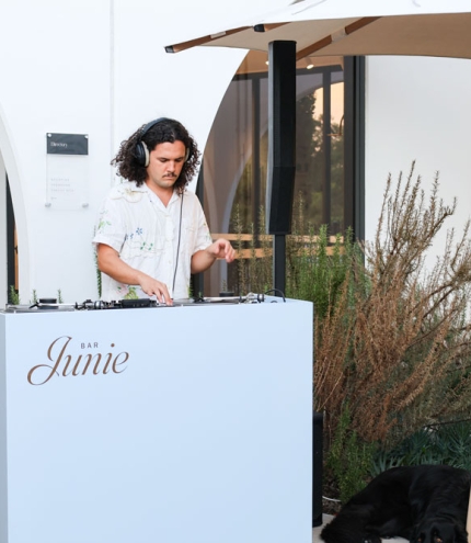 DJ spinning vinyls at Bar Junie 
