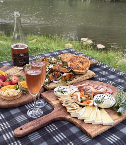 Artsian picnic spread by river at O'reilly's Canungra