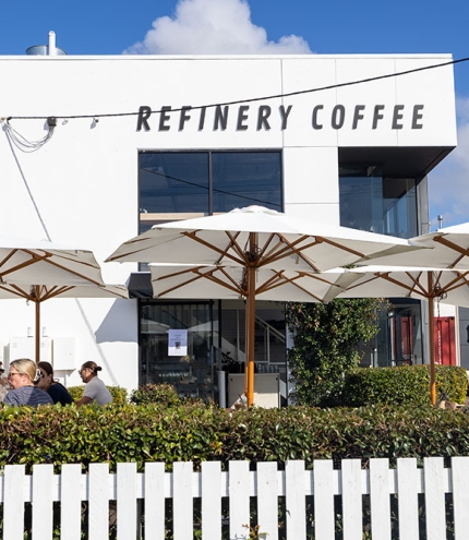 Outside view of Refinery Coffee behind fence