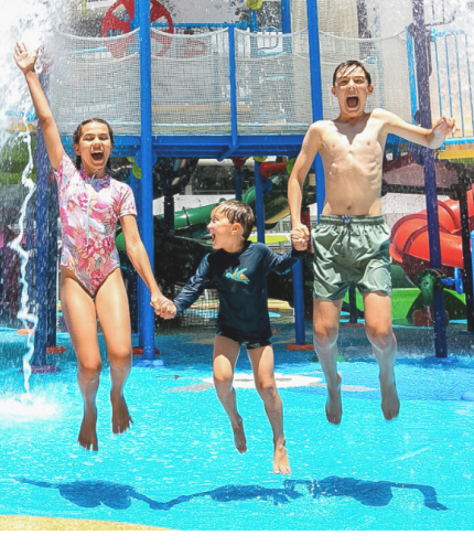 Kids jumping in water park Paradise Resort