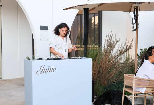 DJ spinning vinyls at Bar Junie 