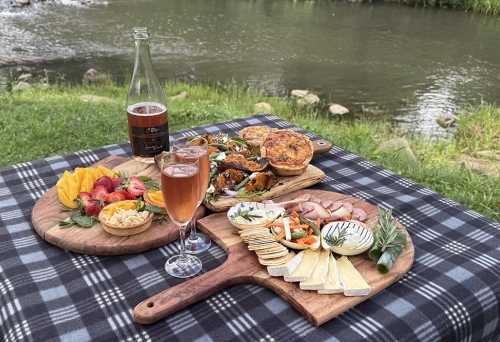 Artsian picnic spread by river at O'reilly's Canungra
