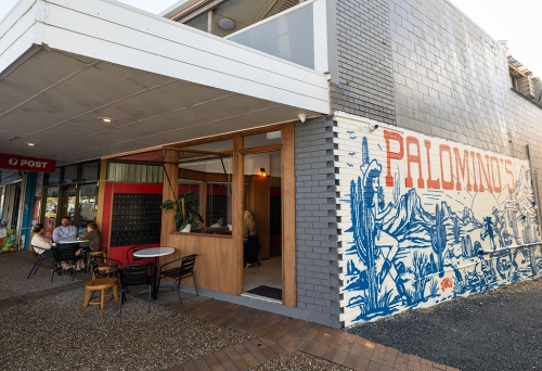Side view with mural of Palomino's Deli