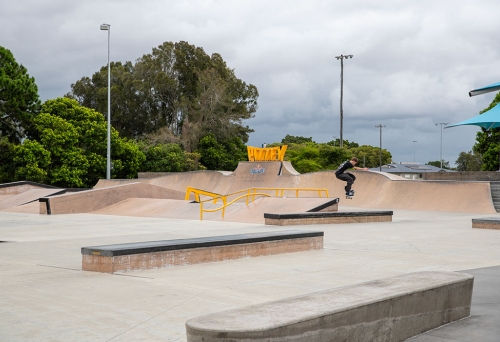 Skate park with jumps and sign