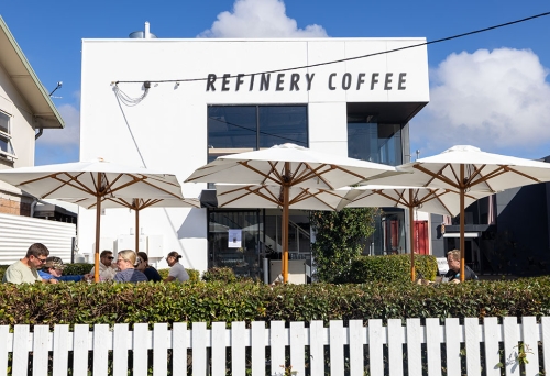 Outside view of Refinery Coffee behind fence