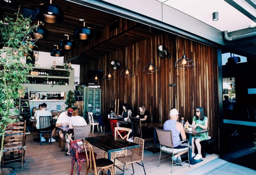 People seated at entrance of Rise & Set Coombabah