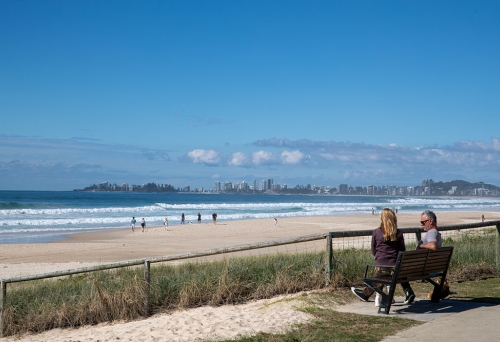 People on seat overlooking Tugun Beach