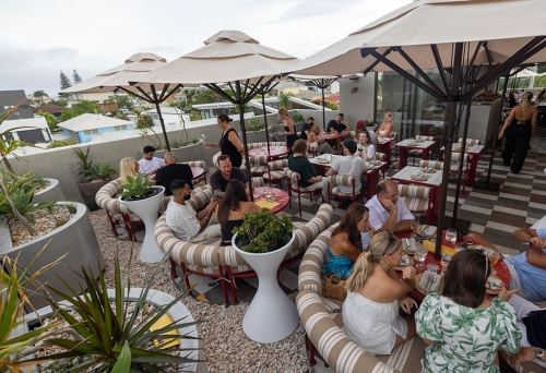 people on rooftop at Nobby Beach