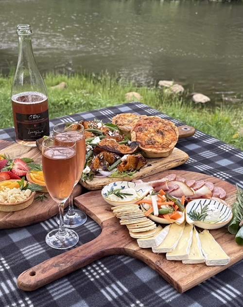 Artsian picnic spread by river at O'reilly's Canungra
