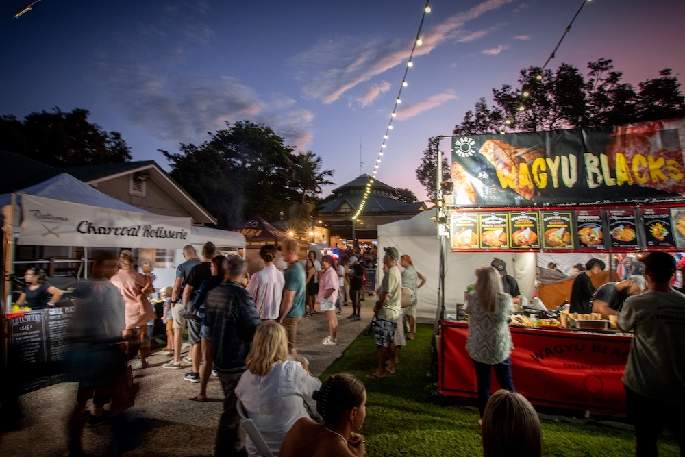 Night food market with string lights