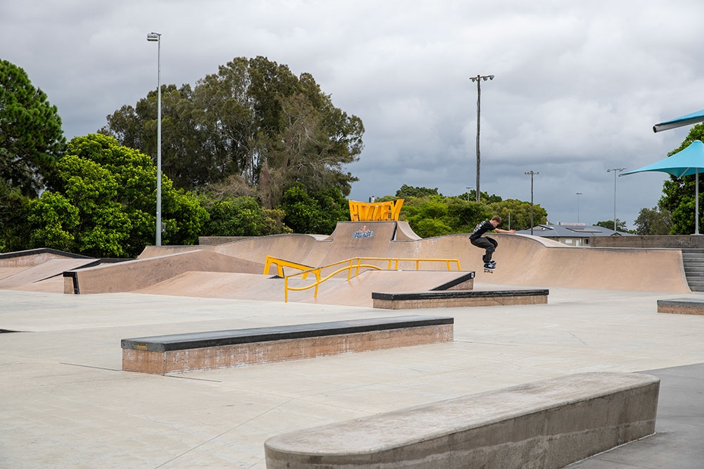 Skate park with jumps and sign