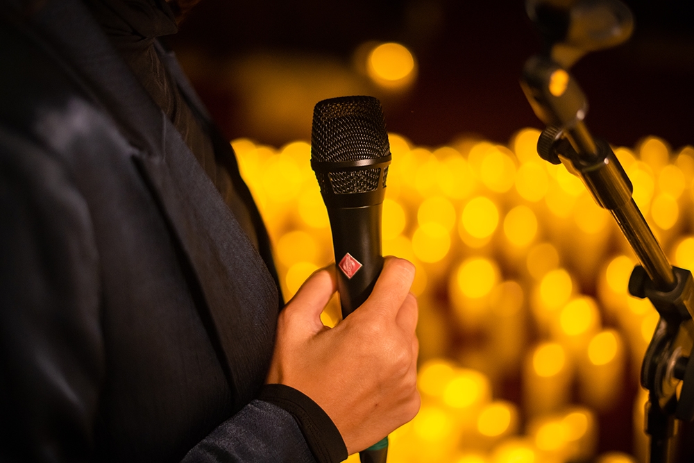 Microphone on candlelit stage at Candlelight: Best of Bridgerton on Strings, Imperial Hotel, Main Beach