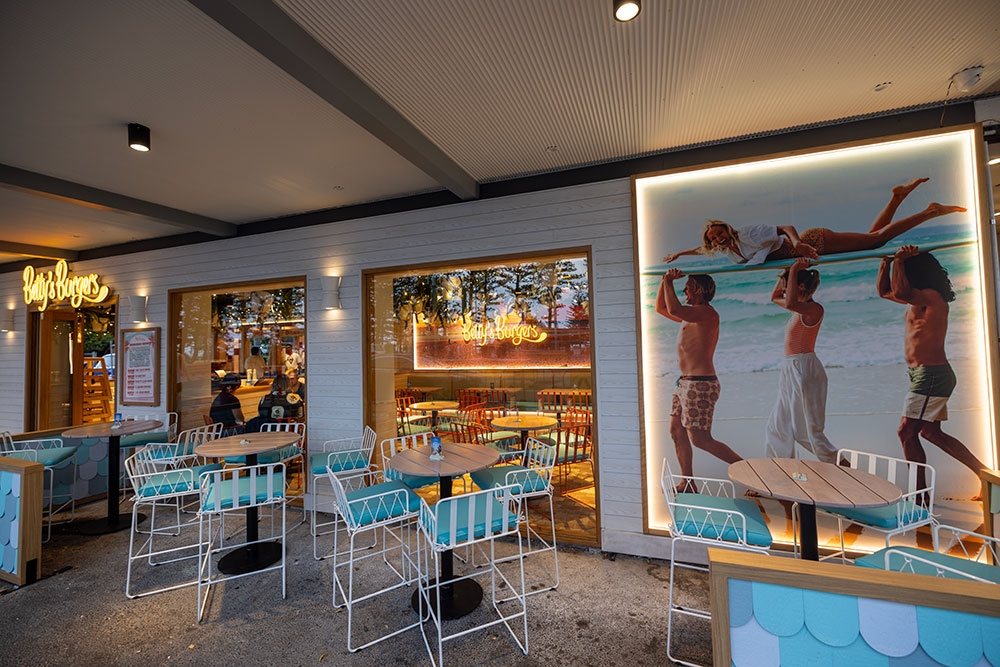 Seating along wall outside Betty's Burgers Palm Beach