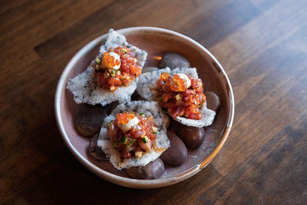 Sashimi tartare on black prawn crackers Bistro Lamp