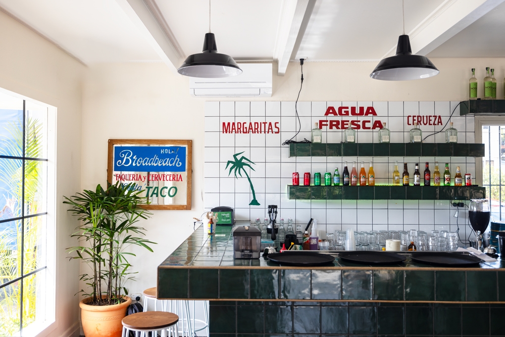 Interior shot of bar a war decals, Costa Taco Broadbeach