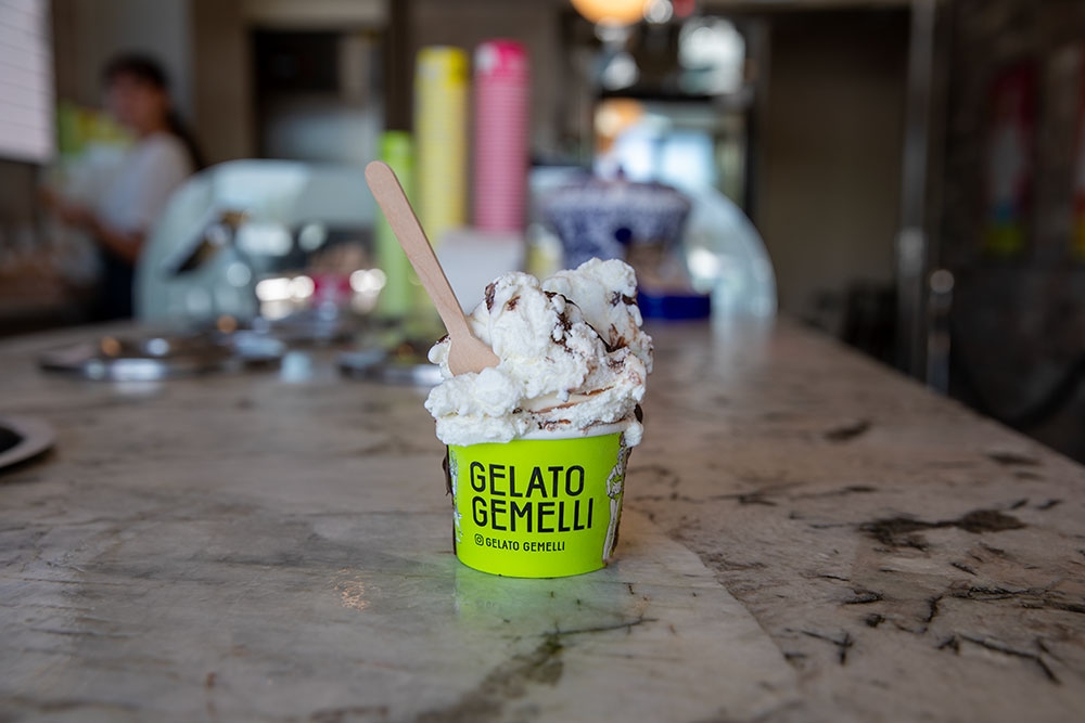 Cup of gelaton on counter at Gelato Gemelli