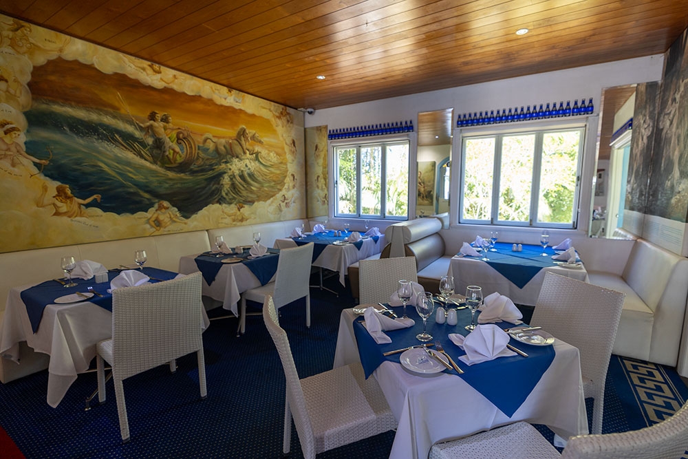 Tables and mural inside George's Paragon