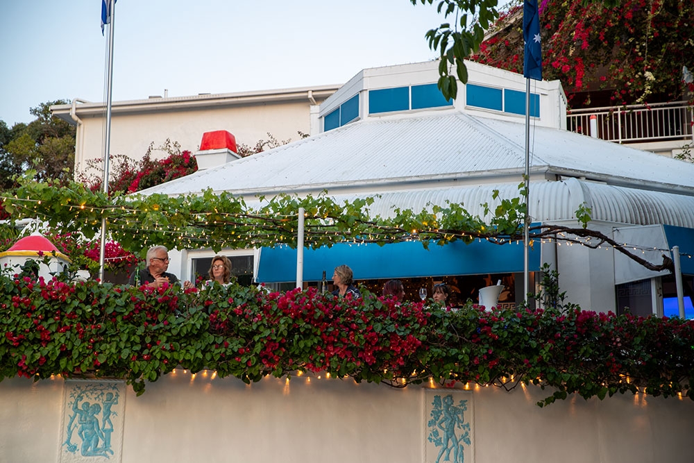 Bougainvillea coovered wall in front of Georges Paragon Restaurant