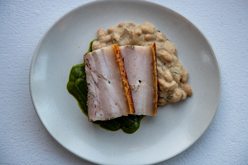 Pork belly with beans & salsa verde at Hanks Kirra