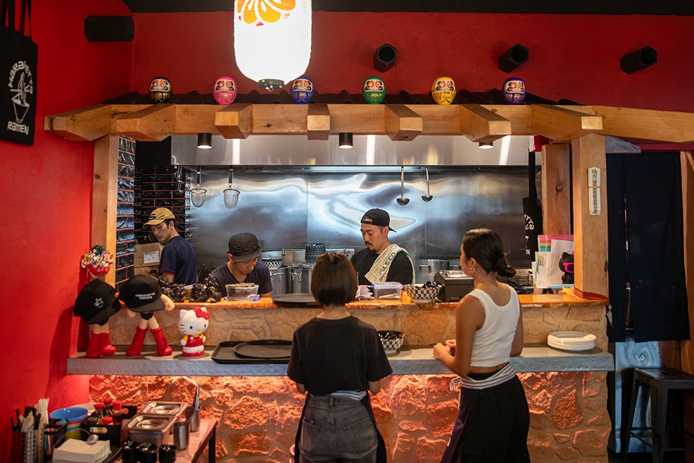 Chefs in kitchen at Harahetta Ramen