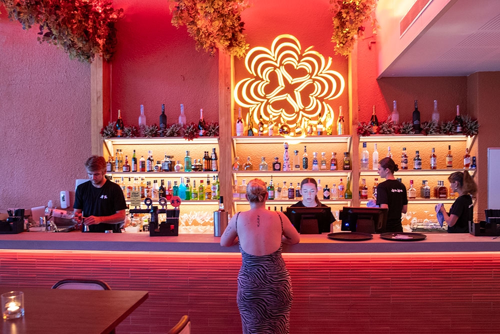Woman at Bar in Juju Mermaid Beach