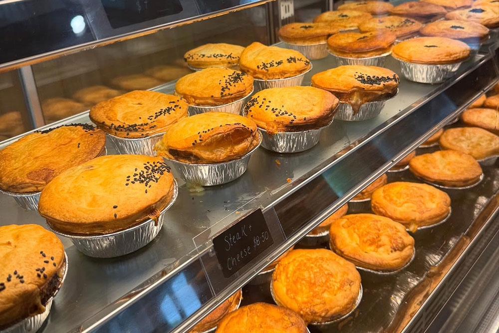 Racks of pies at Little Kiwi Bakehouse