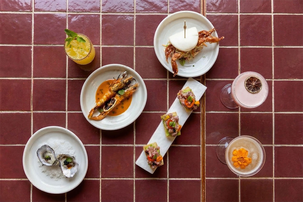 Selection of small plates on tiled table at La Stradina
