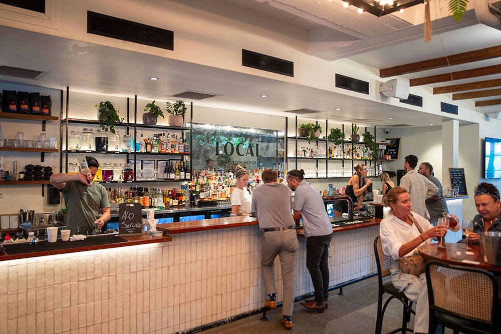 People standing at bar at Local Burleigh Heads