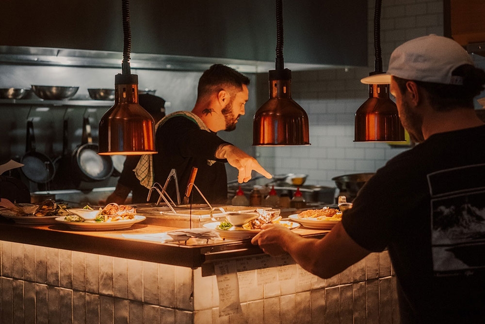 Waiter and chef at Local kitchen