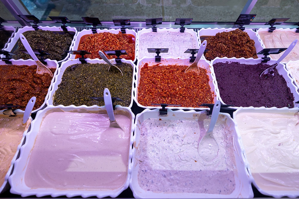 Tubs of dips inside counter at Naheda's Dip House