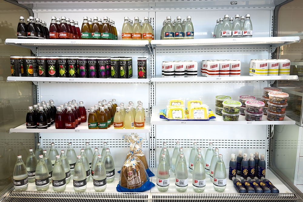 Shelves of deli items & drinks in  Nico deli shop Kirra
