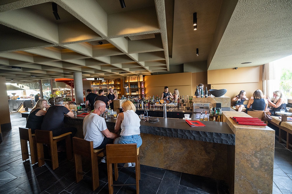 Couple seated at bar inside Norte