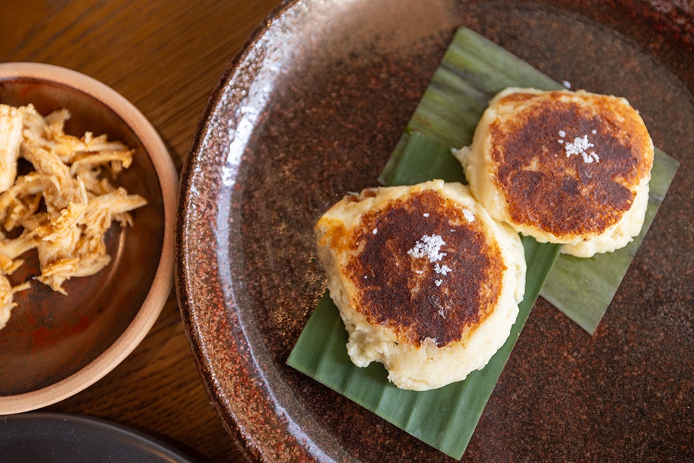 Cheese arepa with shredded chicken at Norte