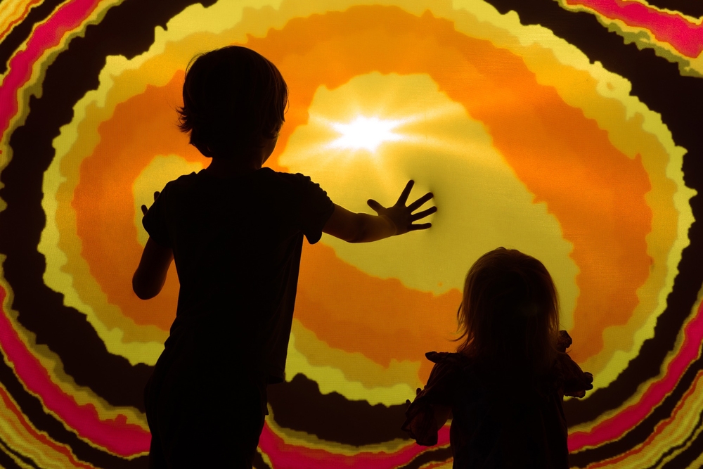 Kids interacting with art Otherworld Byron Bay