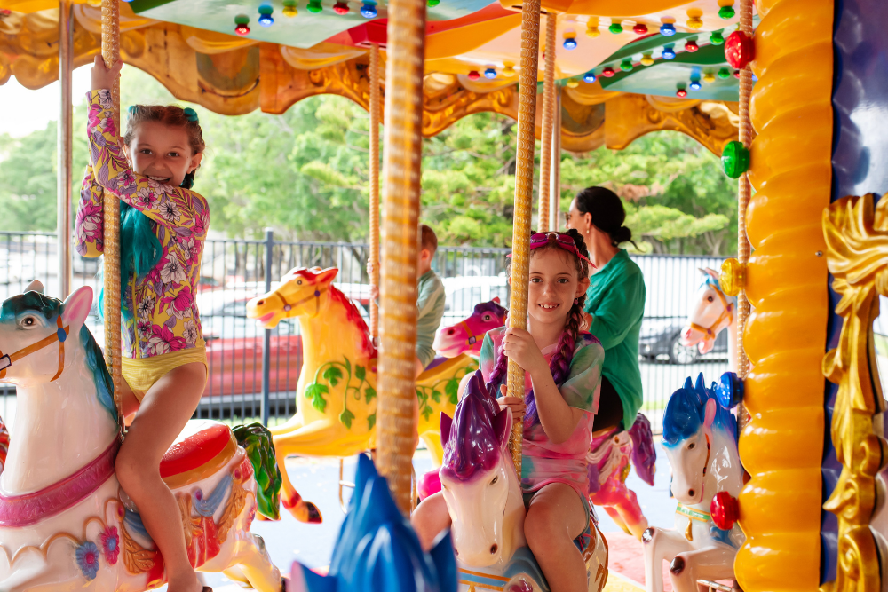 Children on a merry-go-round at Doin’ It for the Kids at Paradise Resort, Surfers Paradise