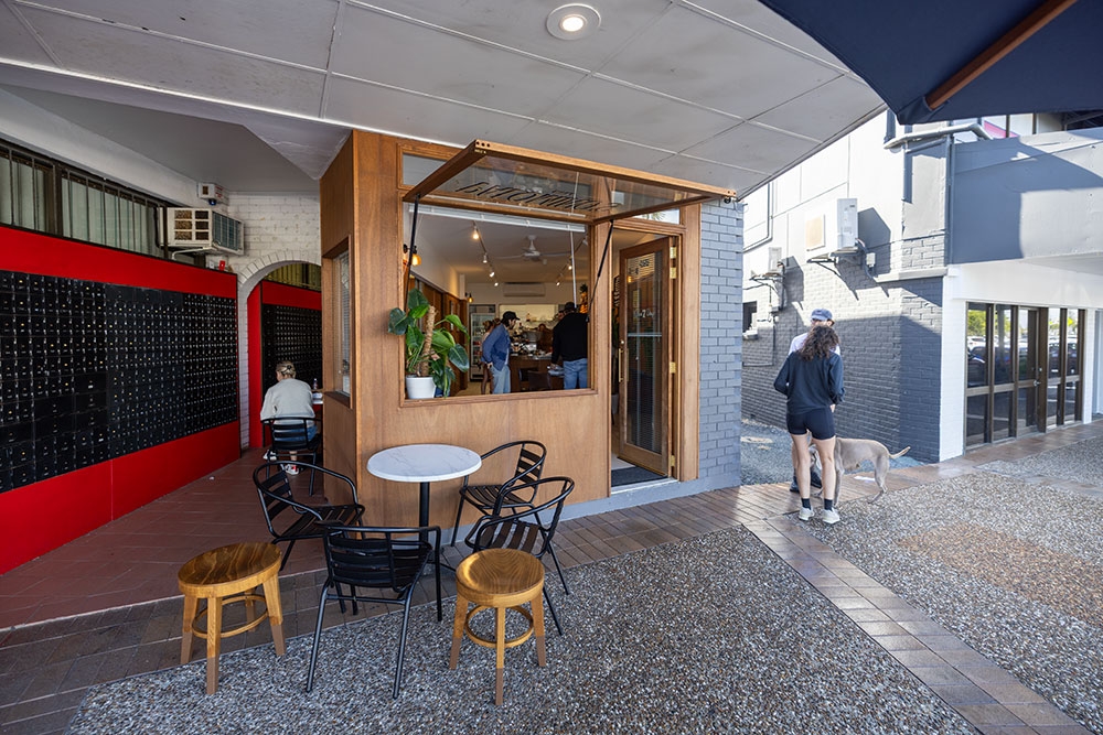 People seated at table outside Palomino's Deli Tugun