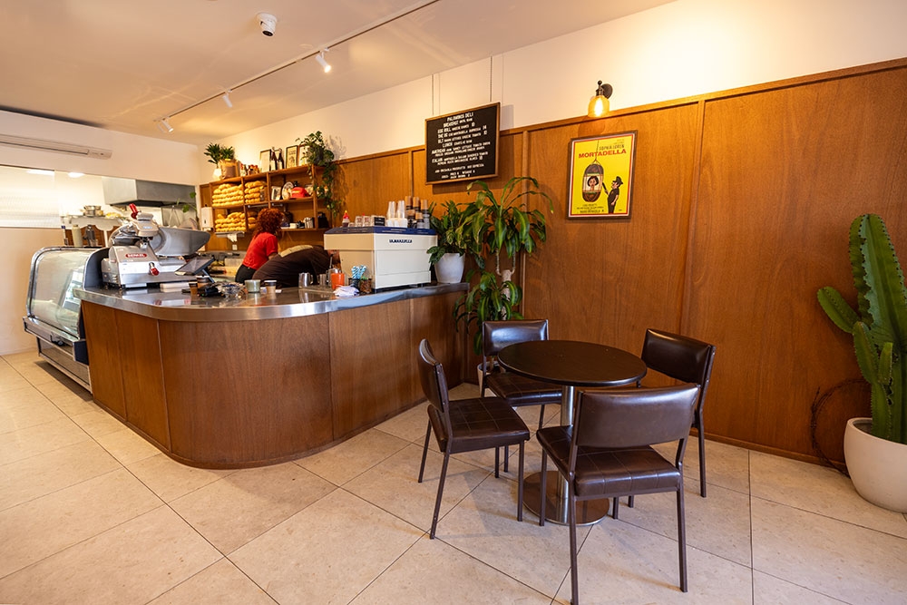 Tables and chairs inside Palomino's Deli