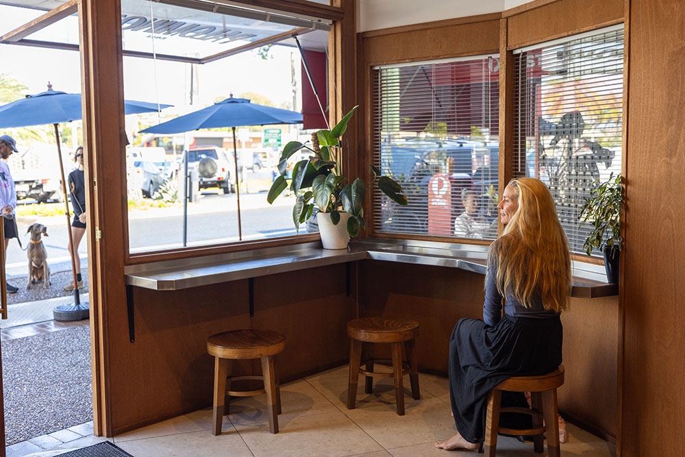 People seated in front corner at Palomino's Deli