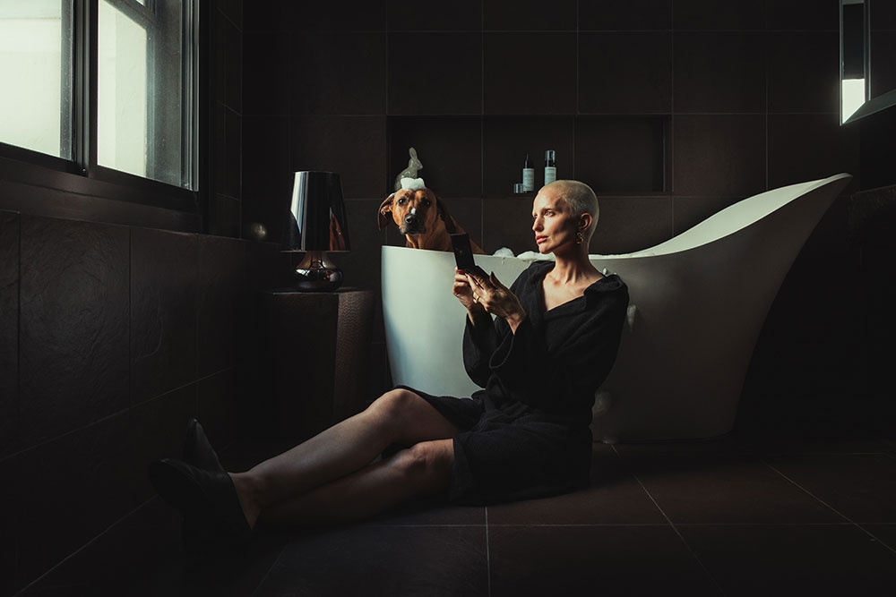 Dog in bath at hotel room QT