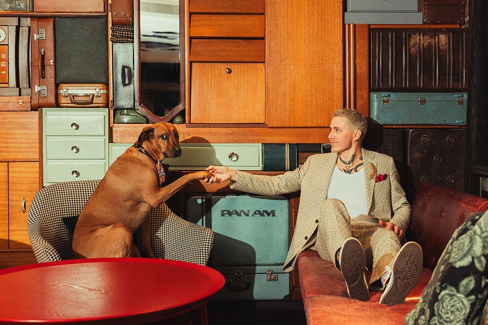 Man with dog in hotel room QT 