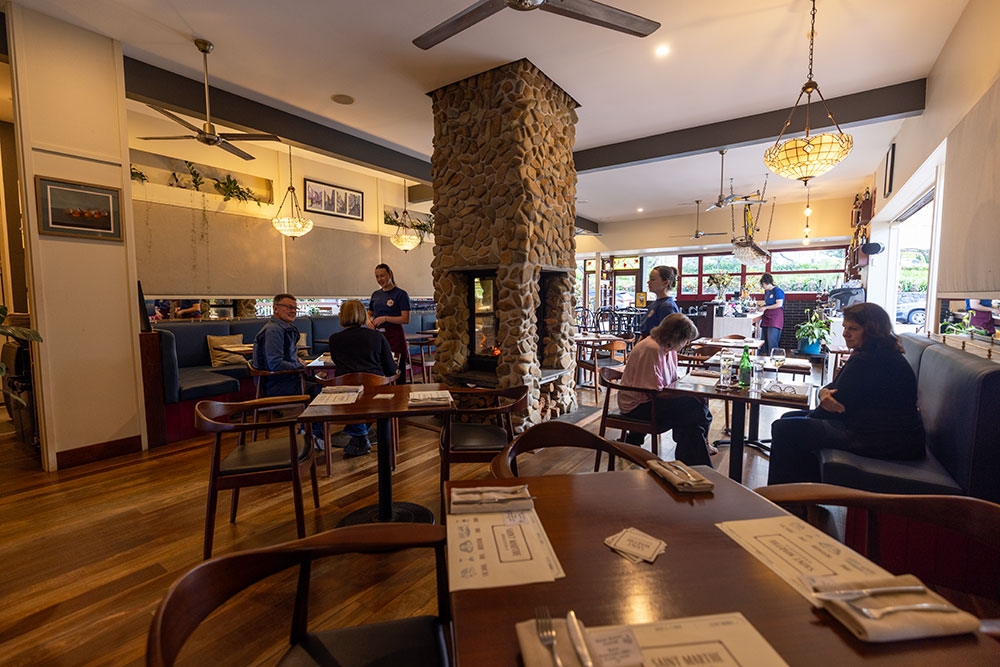 seating and fireplace inside St Marthe Brasserie