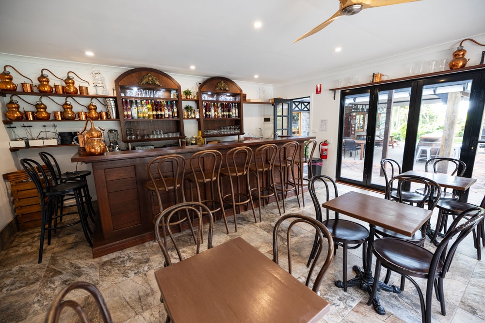 Wooden bar and seating inside Tamborine Mountain Distillery Tamborine Mountain