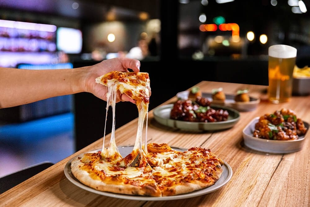 Pizza and food options at X-Golf 